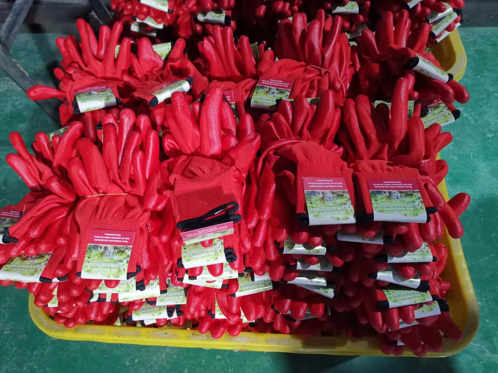 Red coated gloves prepared for packing